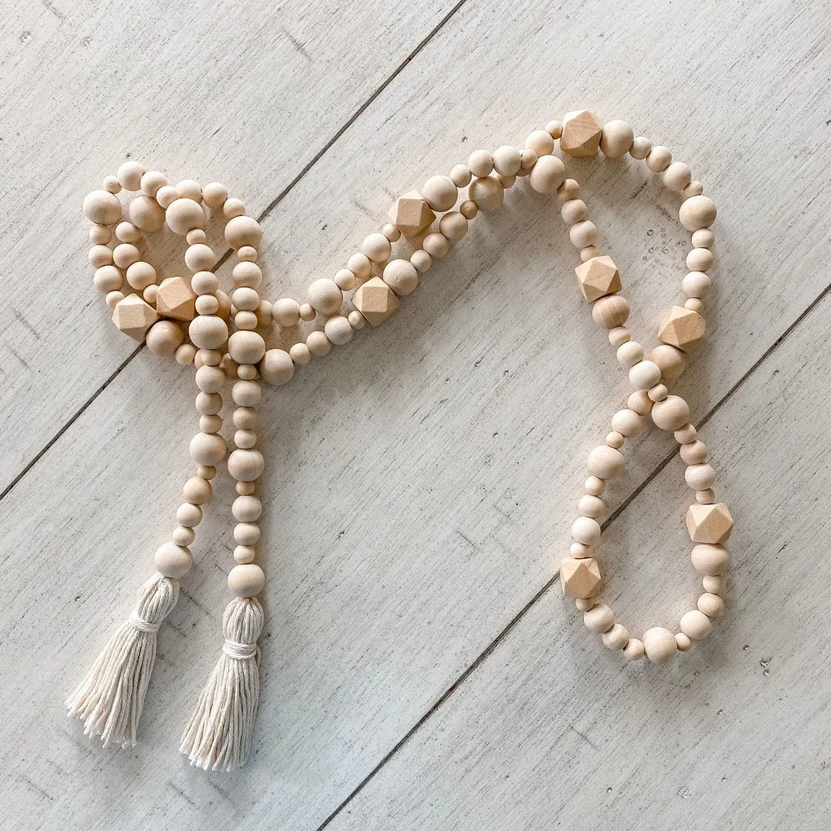 Geometric wood bead garland with tassels